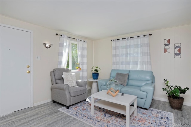 living room with light wood-style floors and baseboards