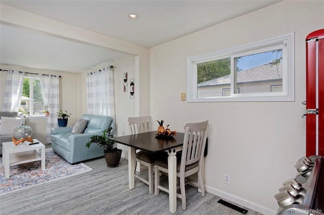 dining room featuring visible vents, recessed lighting, light wood-style flooring, and baseboards