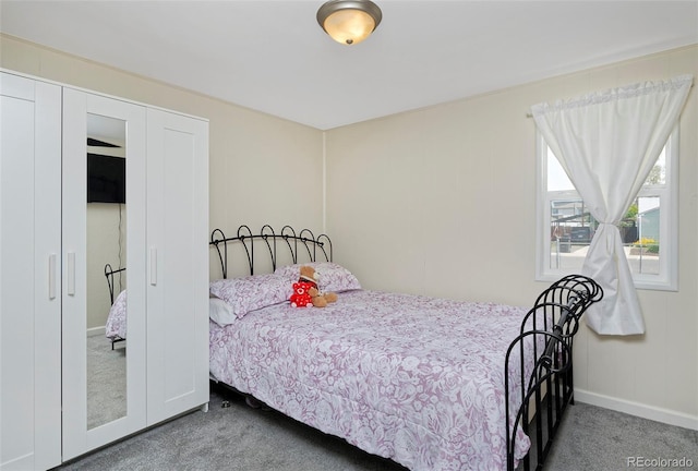 carpeted bedroom with baseboards