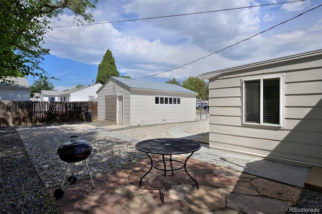 view of patio with fence and an outdoor structure