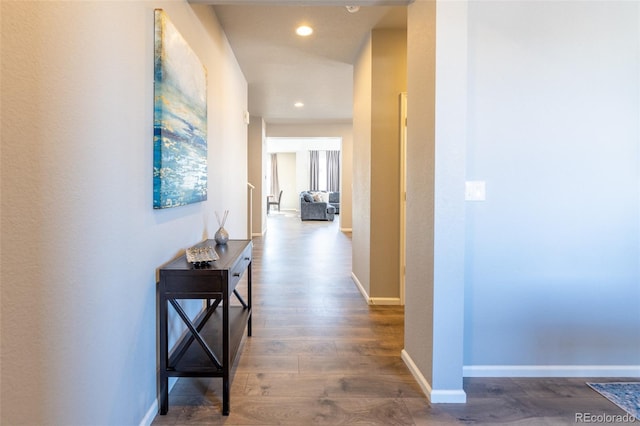 corridor featuring dark hardwood / wood-style floors