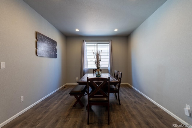 dining space with dark hardwood / wood-style floors