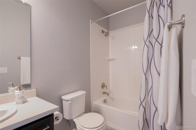 full bathroom featuring shower / tub combo with curtain, vanity, and toilet