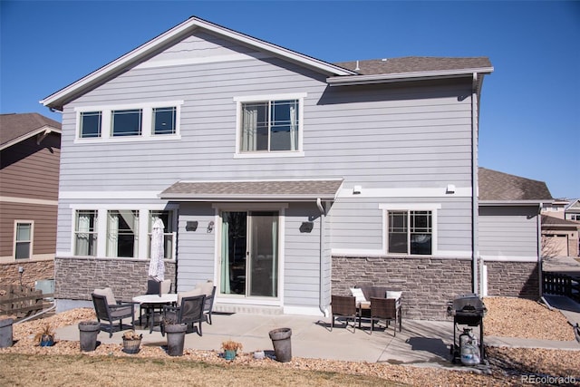 rear view of house featuring a patio