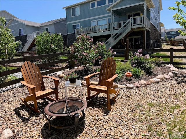 back of house featuring a fire pit