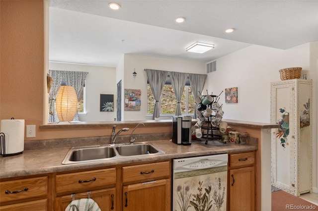3755 Hartsock Ln Unit 102, Colorado Springs, CO 80917 - kitchen featuring white dishwasher, a sink, brown cabinets, and recessed lighting