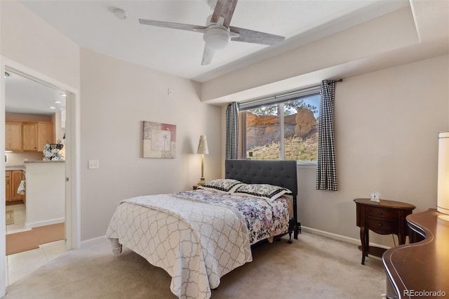 3755 Hartsock Ln Unit 102, Colorado Springs, CO 80917 - bedroom with light carpet, baseboards, and ceiling fan