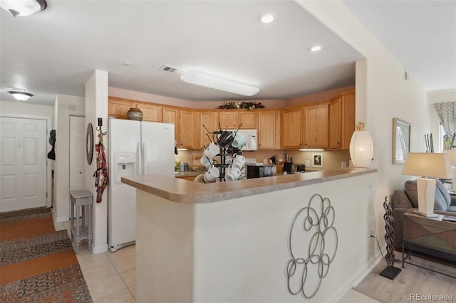 3755 Hartsock Ln Unit 102, Colorado Springs, CO 80917 - kitchen featuring white appliances, a peninsula, baseboards, light tile patterned flooring, and recessed lighting