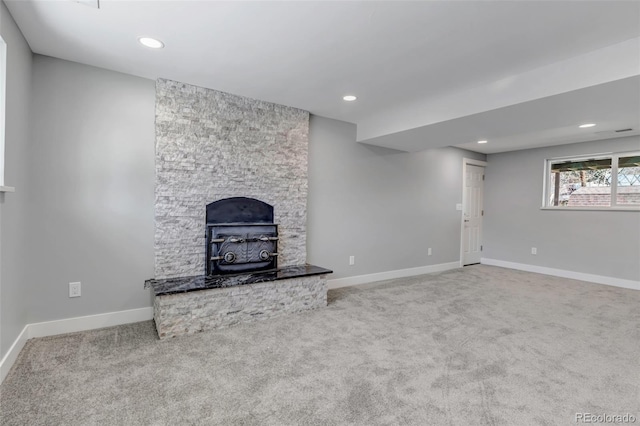 unfurnished living room featuring carpet flooring, recessed lighting, and baseboards