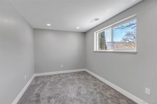 unfurnished room featuring visible vents, recessed lighting, carpet, and baseboards