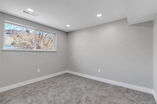 carpeted empty room with visible vents, recessed lighting, and baseboards