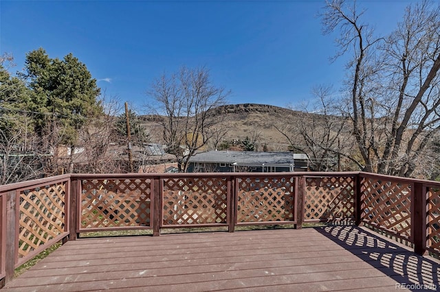 wooden deck with a mountain view