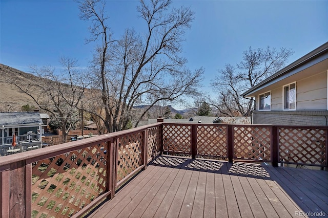 wooden deck featuring a mountain view