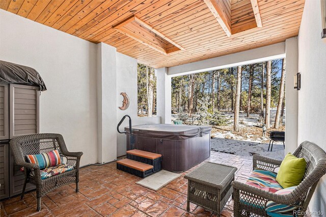 view of patio / terrace featuring a hot tub