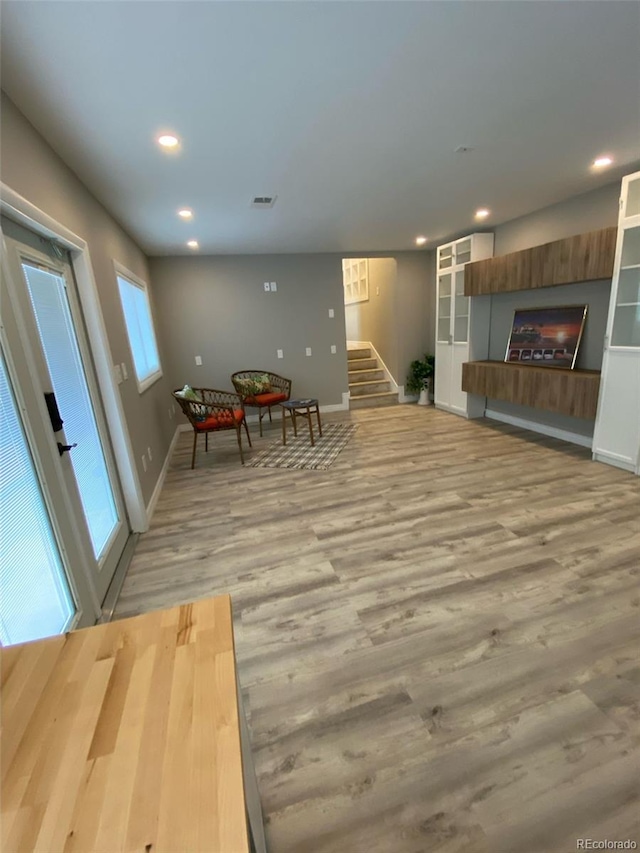 unfurnished living room featuring light hardwood / wood-style floors