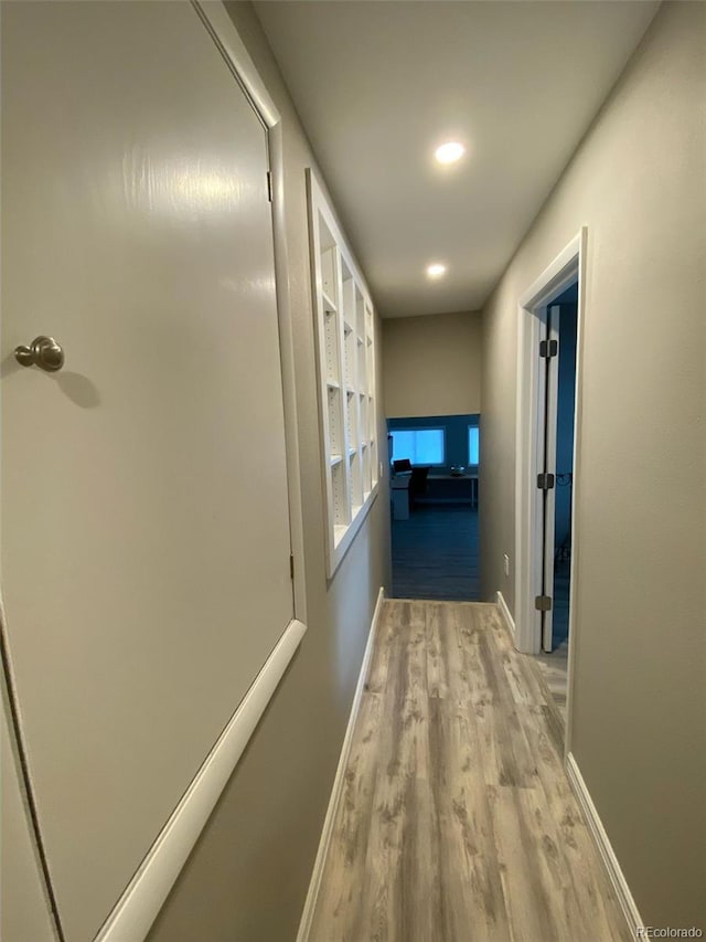 hall with light wood-type flooring