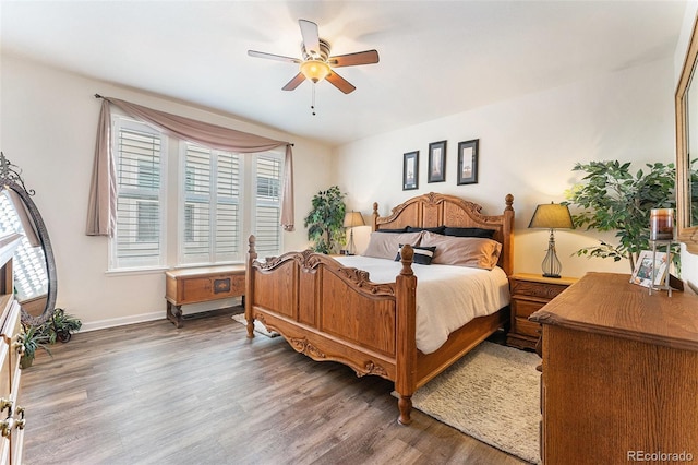 19780 W 57th Ln, Golden, CO 80403 - bedroom featuring wood finished floors, baseboards, and a ceiling fan