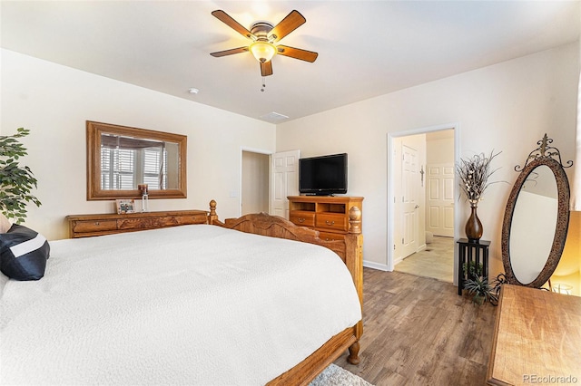 19780 W 57th Ln, Golden, CO 80403 - bedroom with light wood finished floors, baseboards, and ceiling fan