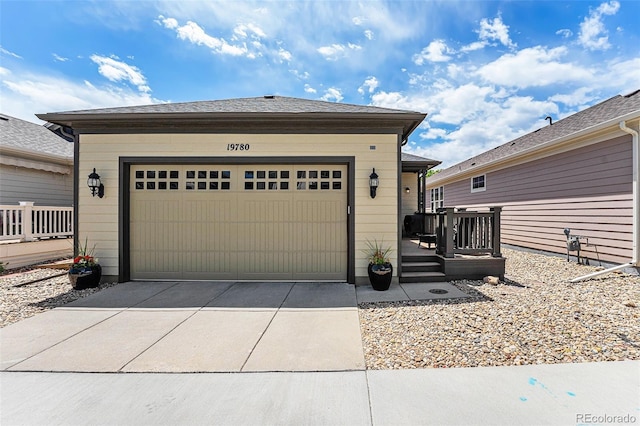 19780 W 57th Ln, Golden, CO 80403 - view of front of home featuring driveway and a wooden deck