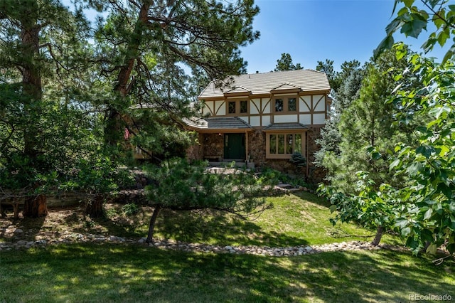 9420 Mcgill Ct, Parker, CO 80134 - rear view of house featuring a yard, stucco siding, and stone siding