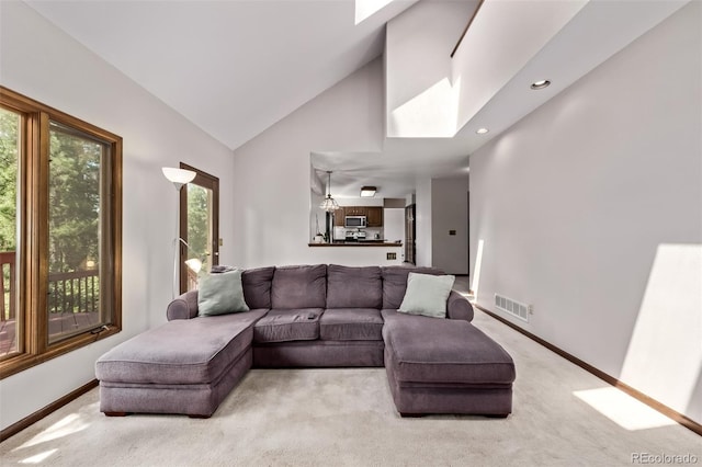 9420 Mcgill Ct, Parker, CO 80134 - living room featuring carpet flooring, a skylight, high vaulted ceiling, and recessed lighting