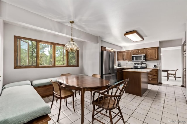 9420 Mcgill Ct, Parker, CO 80134 - dining room with light tile patterned flooring and a chandelier