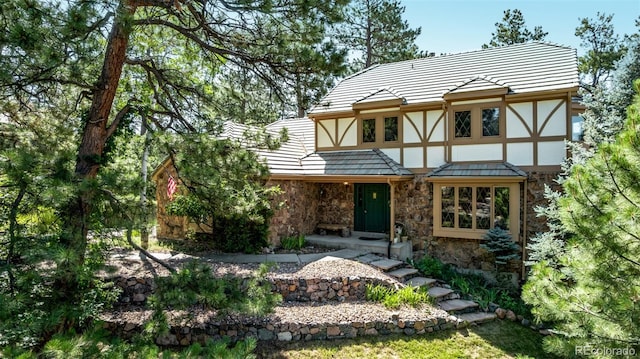 9420 Mcgill Ct, Parker, CO 80134 - view of front of property with stone siding, stucco siding, and a tiled roof