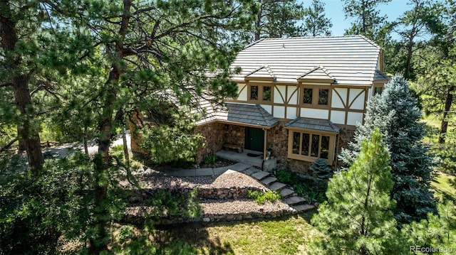 9420 Mcgill Ct, Parker, CO 80134 - back of house featuring stone siding and stucco siding