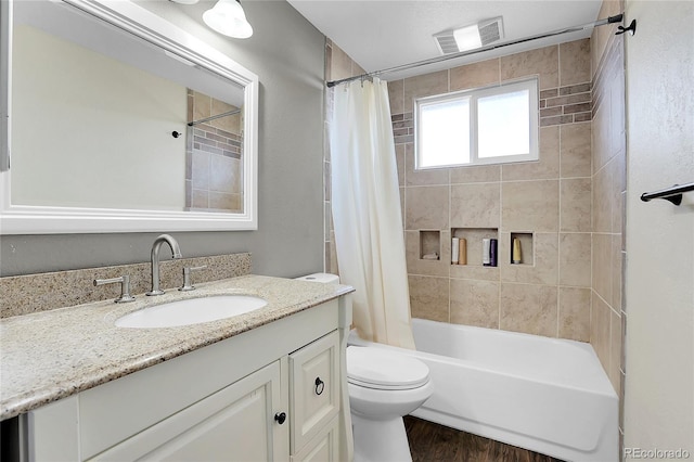 full bathroom with wood-type flooring, vanity, shower / bath combination with curtain, and toilet