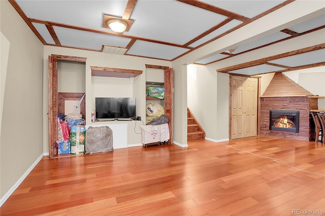 unfurnished living room featuring a fireplace and hardwood / wood-style flooring