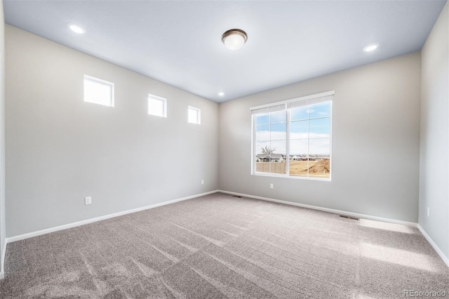 4947 N Quatar St, Aurora, CO 80019 - carpeted spare room featuring baseboards and recessed lighting