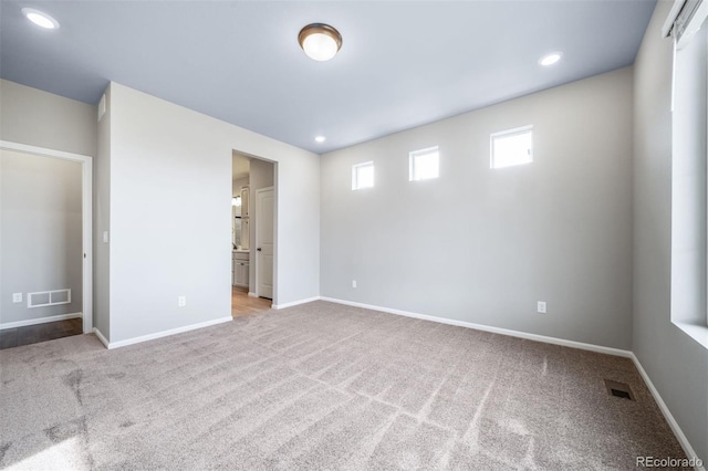 4947 N Quatar St, Aurora, CO 80019 - unfurnished bedroom featuring carpet floors, recessed lighting, and connected bathroom