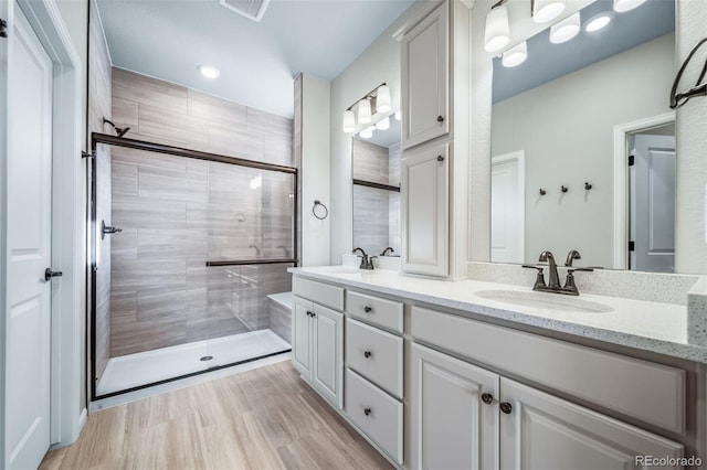4947 N Quatar St, Aurora, CO 80019 - bathroom with double vanity and a tile shower