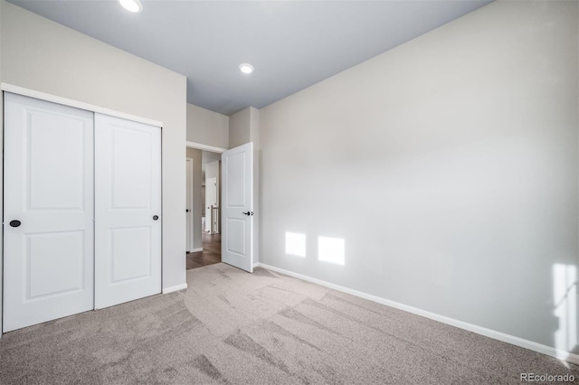 4947 N Quatar St, Aurora, CO 80019 - unfurnished bedroom featuring carpet, a closet, and recessed lighting
