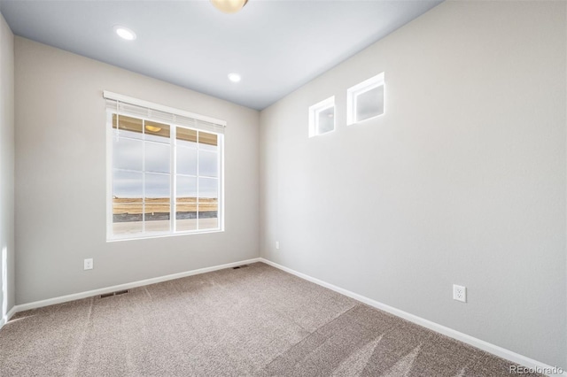 4947 N Quatar St, Aurora, CO 80019 - unfurnished room with healthy amount of natural light, carpet floors, and recessed lighting