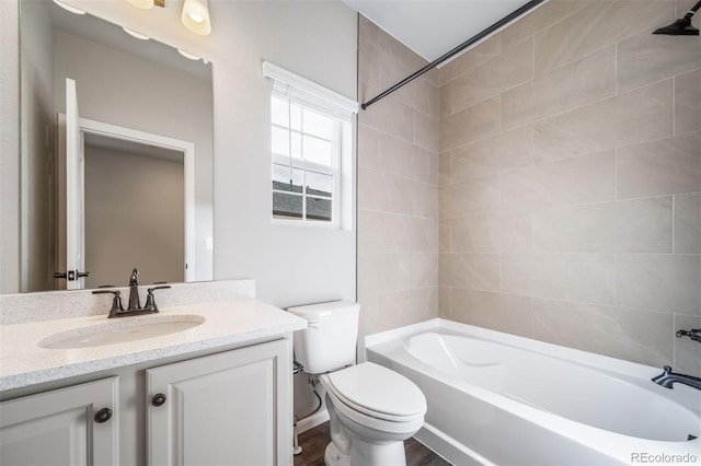 4947 N Quatar St, Aurora, CO 80019 - bathroom featuring vanity, bathtub / shower combination, and wood finished floors