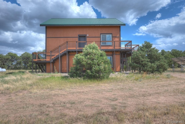 rear view of house with a deck