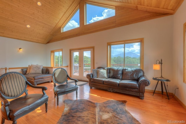 living room with wooden ceiling, high vaulted ceiling, and light hardwood / wood-style floors