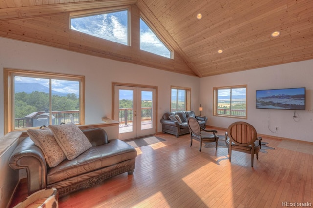 living room with french doors, light hardwood / wood-style flooring, high vaulted ceiling, and wooden ceiling