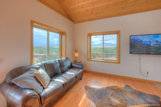 living room with plenty of natural light, wooden ceiling, lofted ceiling, and light wood-type flooring