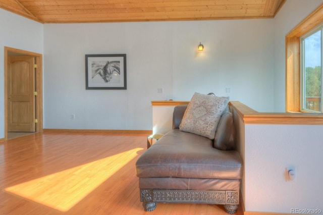 sitting room with hardwood / wood-style flooring and wood ceiling