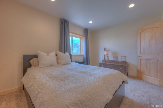 bedroom featuring light carpet