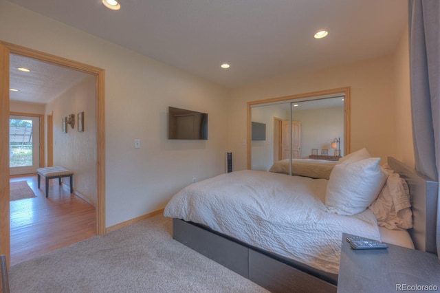 carpeted bedroom with a closet