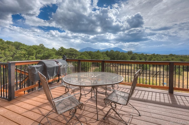 wooden terrace with a mountain view