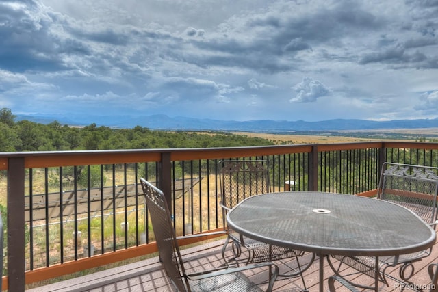 wooden terrace featuring a mountain view