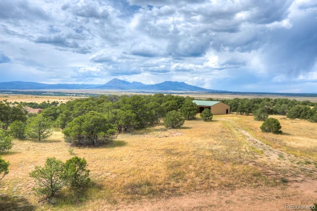 property view of mountains featuring a rural view