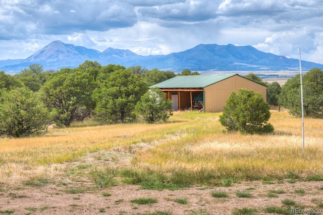 mountain view featuring a rural view