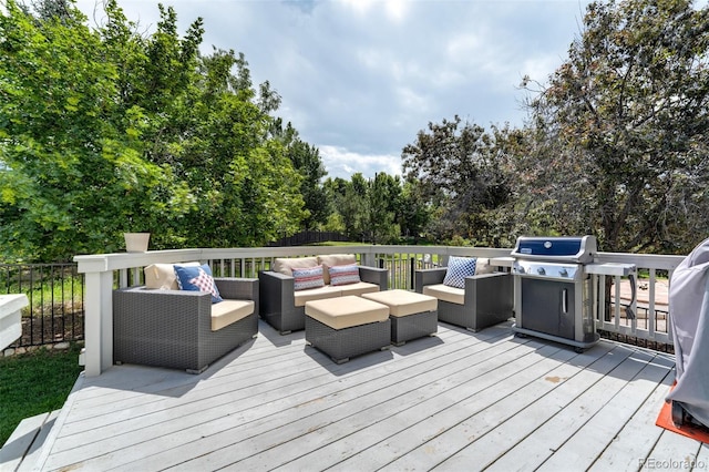 wooden deck with a grill and an outdoor living space