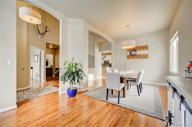 dining space with light wood-type flooring