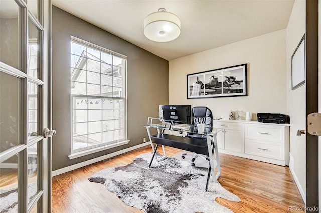 office featuring light wood-type flooring and french doors